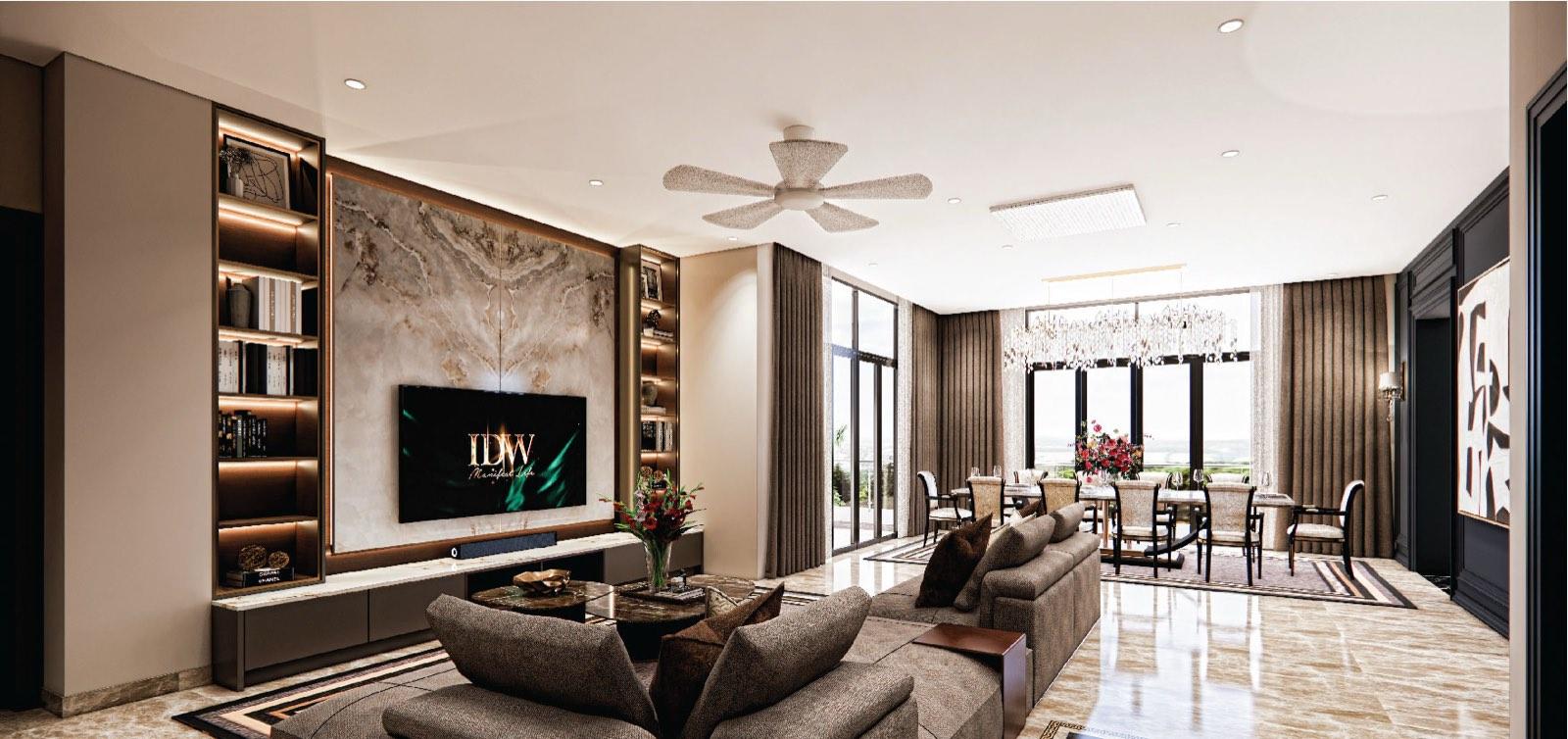 Bright family living room of the Bukit Gambir residence with a marble media wall, ceiling fan and dining table by windows over the strait