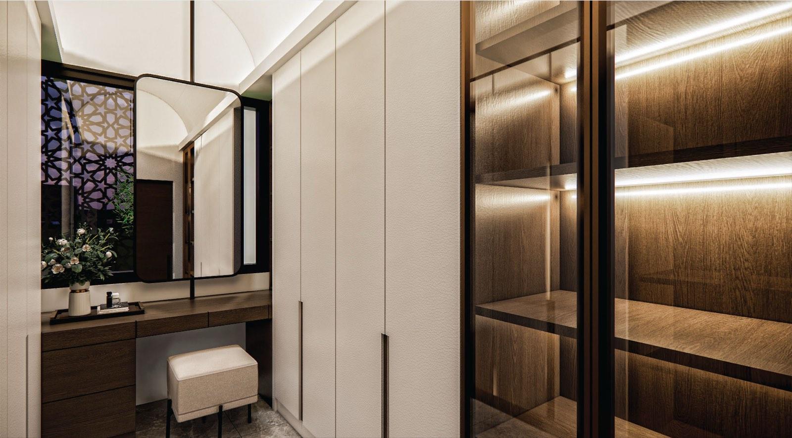 Dressing room of the Johor Bahru residence with a walnut vanity, glazed wardrobes and a mashrabiya-screened window