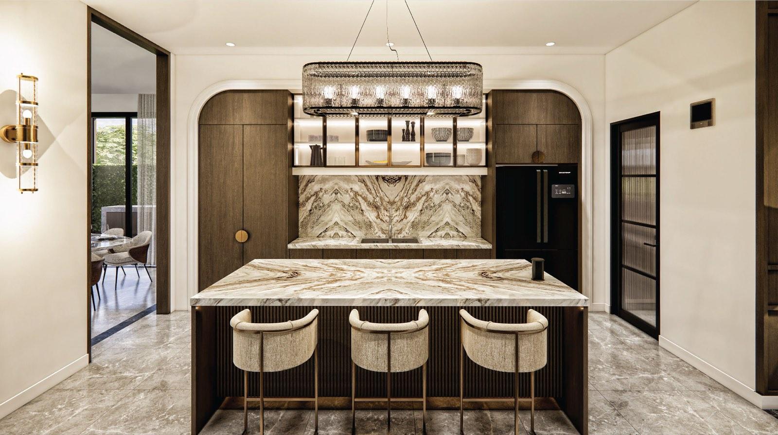 Show kitchen of the Johor Bahru residence with arched walnut cabinetry, bookmatched marble splashback and a fluted island