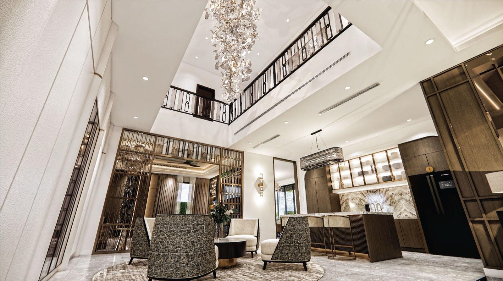 Double-height lounge of the Johor Bahru residence looking toward the bar counter, under a cascading chandelier