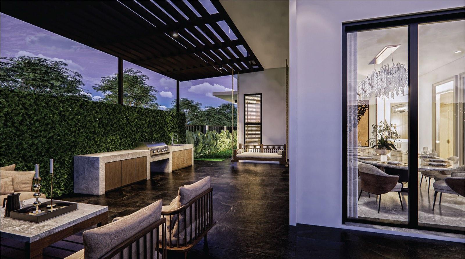 Covered terrace at the Johor Bahru residence with an outdoor barbecue kitchen, pergola and hanging daybed