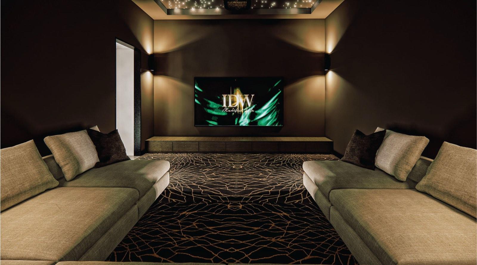Home theatre of the Johor Bahru residence with facing sofas, a starlit ceiling and a patterned dark carpet