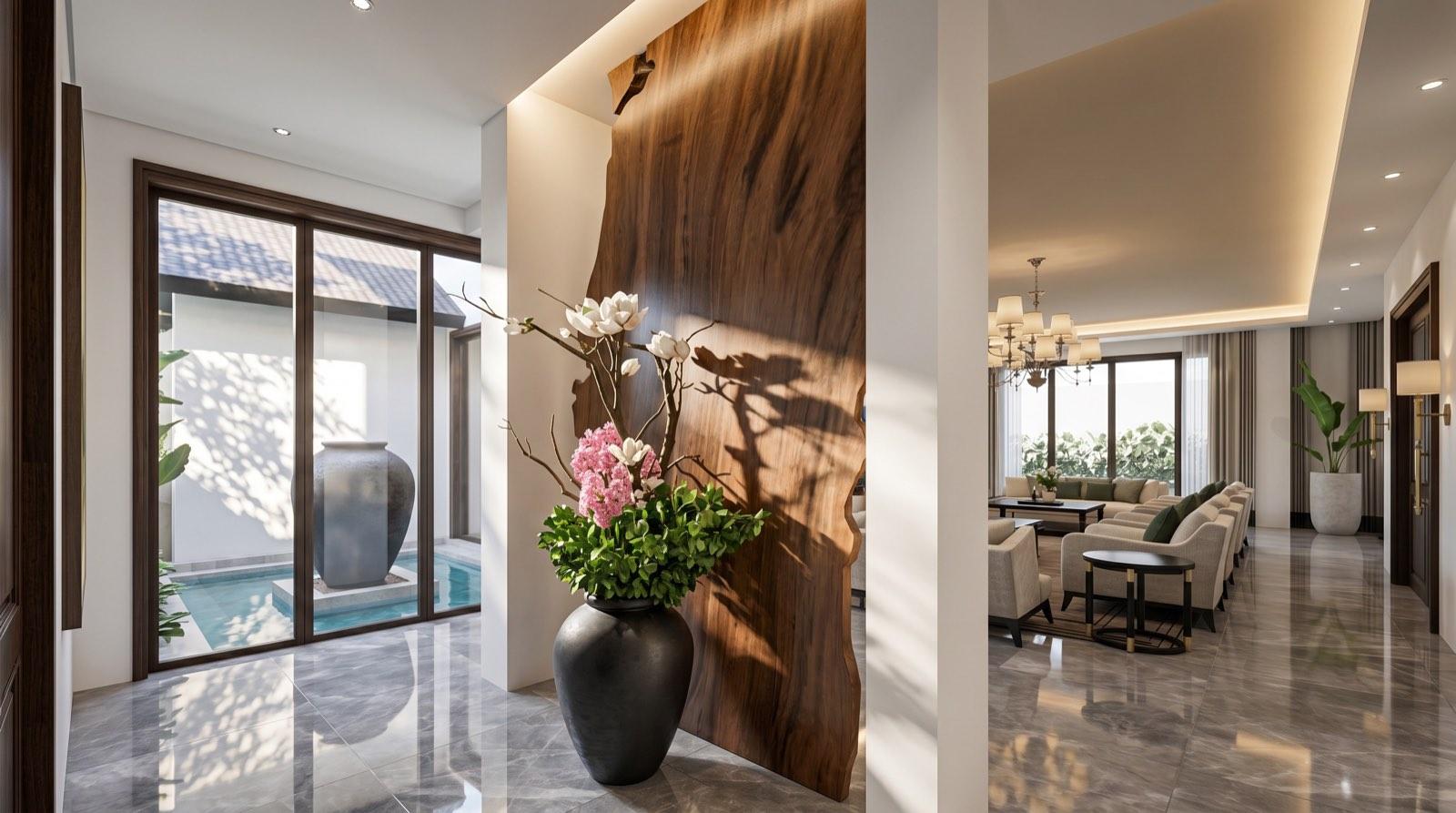 Foyer of the KGSAAS house in Shah Alam with a live-edge timber slab divider and a view to the courtyard water feature