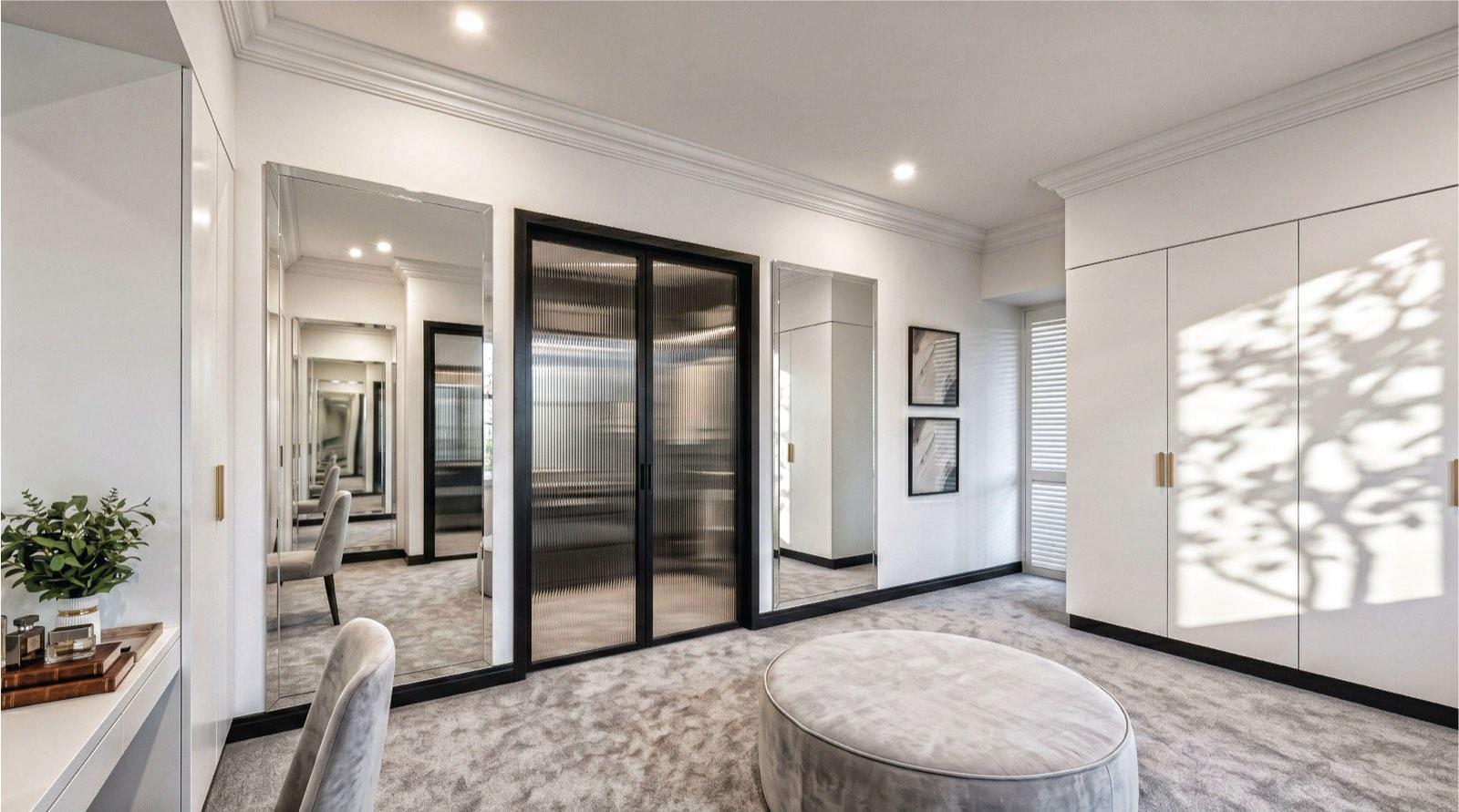 Dressing room of the KGSAAS villa in Shah Alam with full-height mirrors and fluted-glass wardrobe doors
