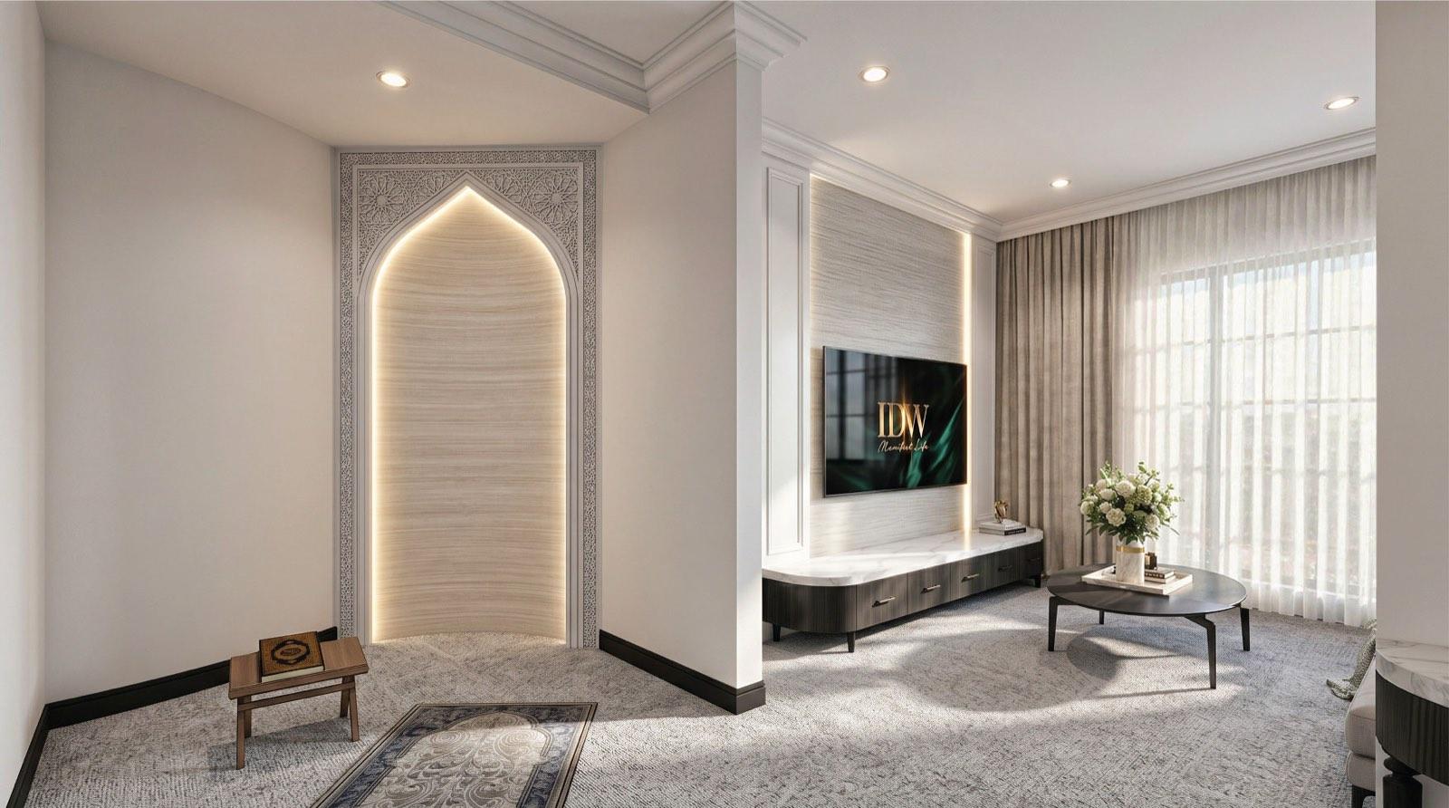 Carpeted prayer room of the KGSAAS villa in Shah Alam with a lit mihrab niche framed in carved arabesque plasterwork