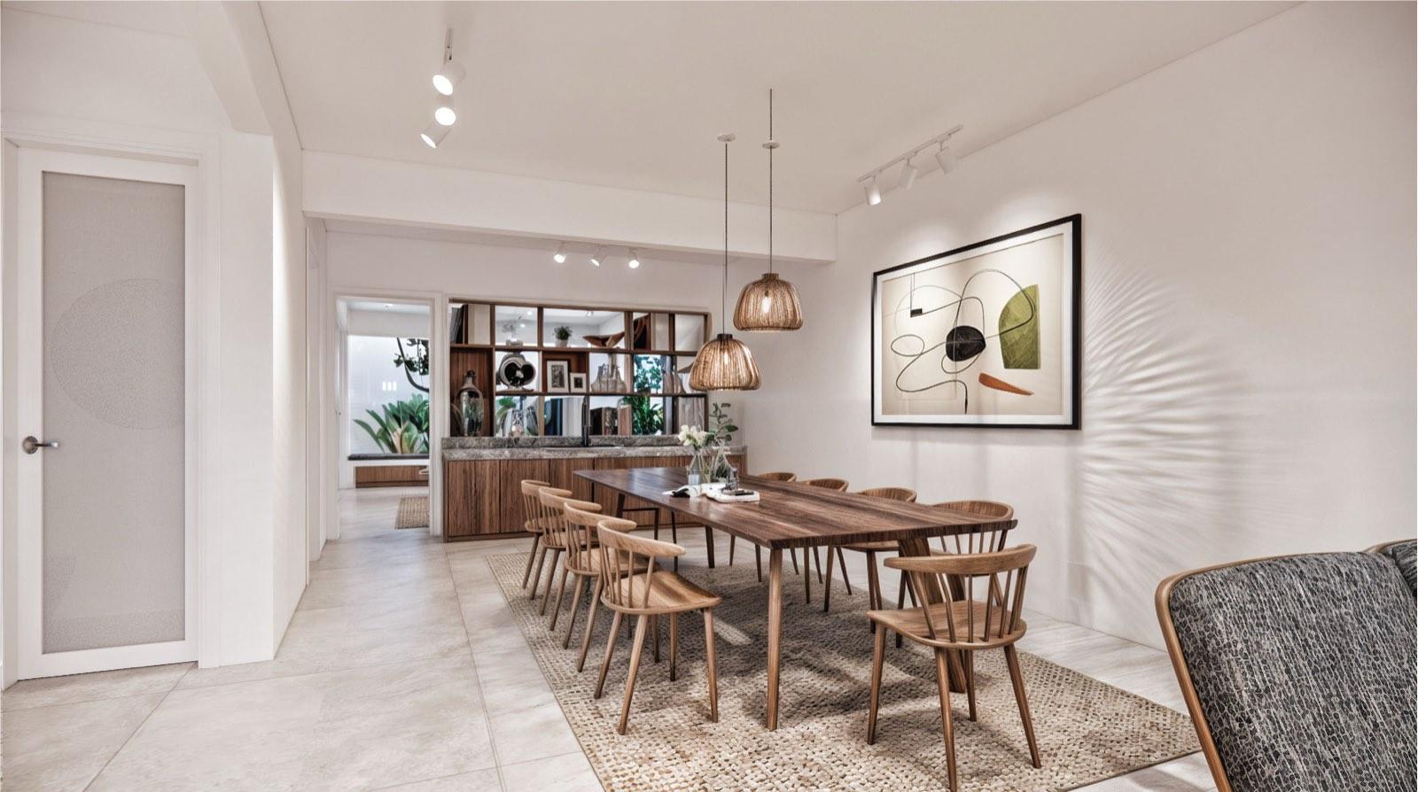 Dining room of the Kuala Lumpur terrace house, a long timber table under rattan pendants beside a mirrored buffet wall