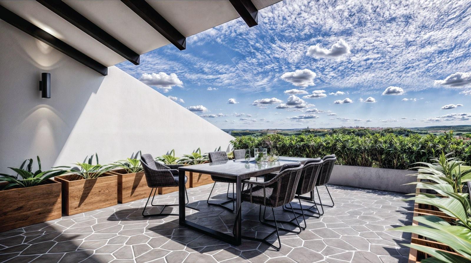 Planted rooftop dining terrace of the Kuala Lumpur terrace house looking out over the skyline