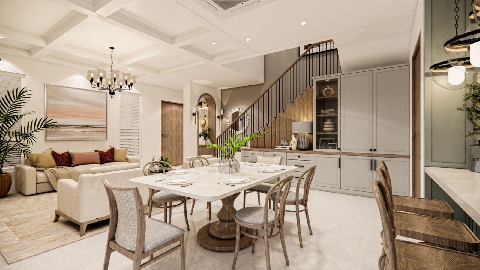 Open dining and living area at the PKNS Kota Puteri show home, with the stair and its grey under-stair cabinetry beyond