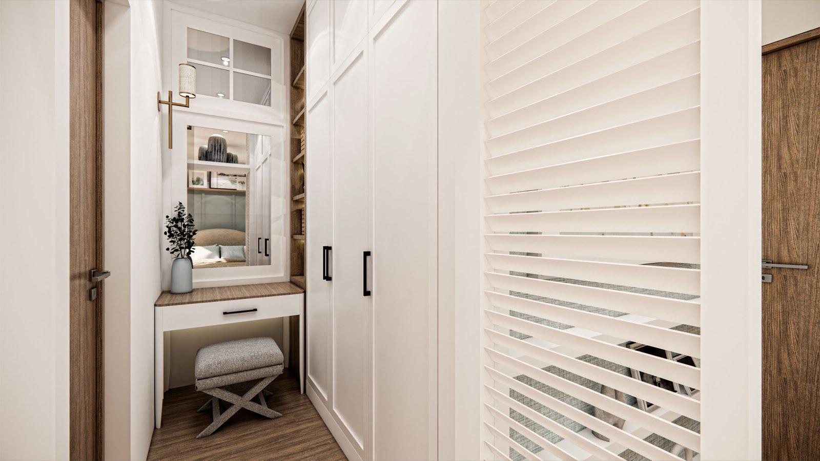 Dressing nook at the PKNS Kota Puteri show home with a mirrored vanity, stool and louvred screen wall