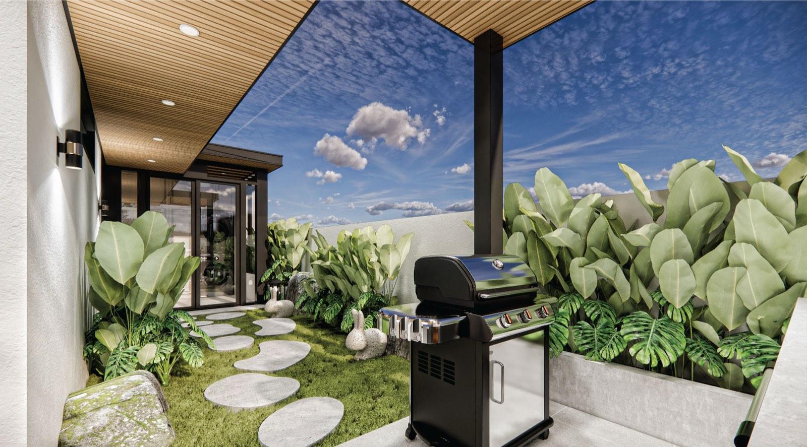 BBQ terrace at Monarc, Gamuda Gardens with a gas grill under a timber-lined canopy and planting on both sides