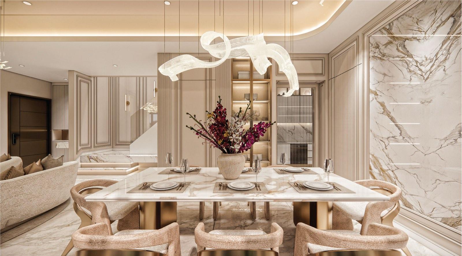 Dining table at Monarc, Gamuda Gardens set for six, framed by a book-matched calacatta marble wall and the stair beyond