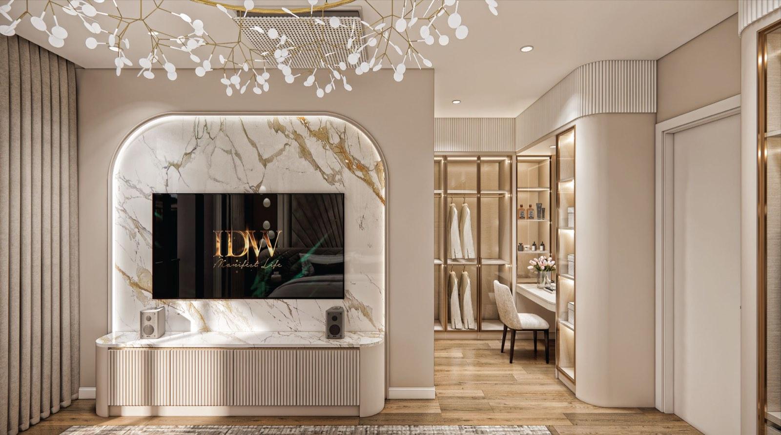 Arched marble television niche in the master suite at Monarc, Gamuda Gardens, with the walk-in wardrobe and vanity beyond
