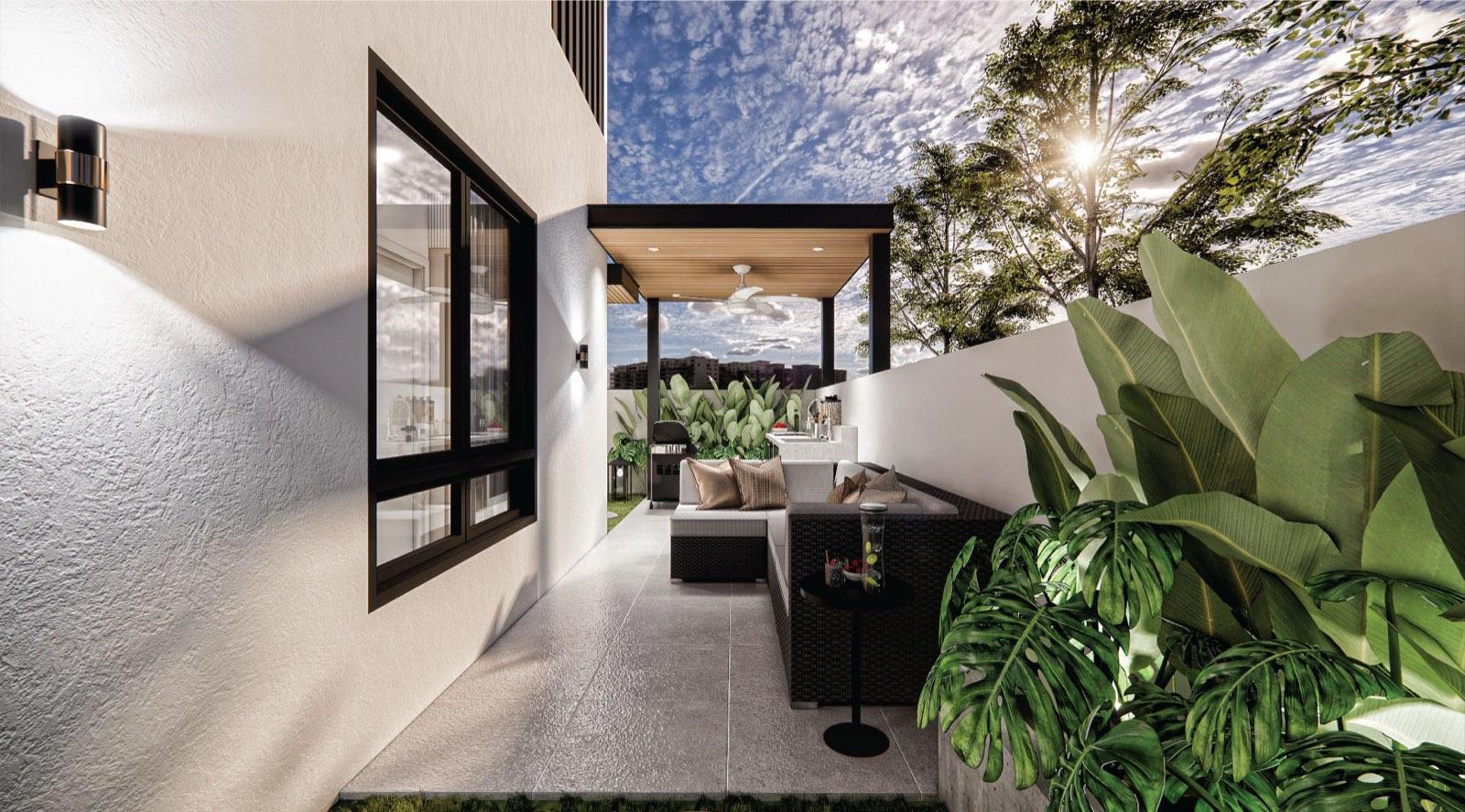Covered outdoor lounge at Monarc, Gamuda Gardens under a timber-slat pergola, wrapped in tropical planting
