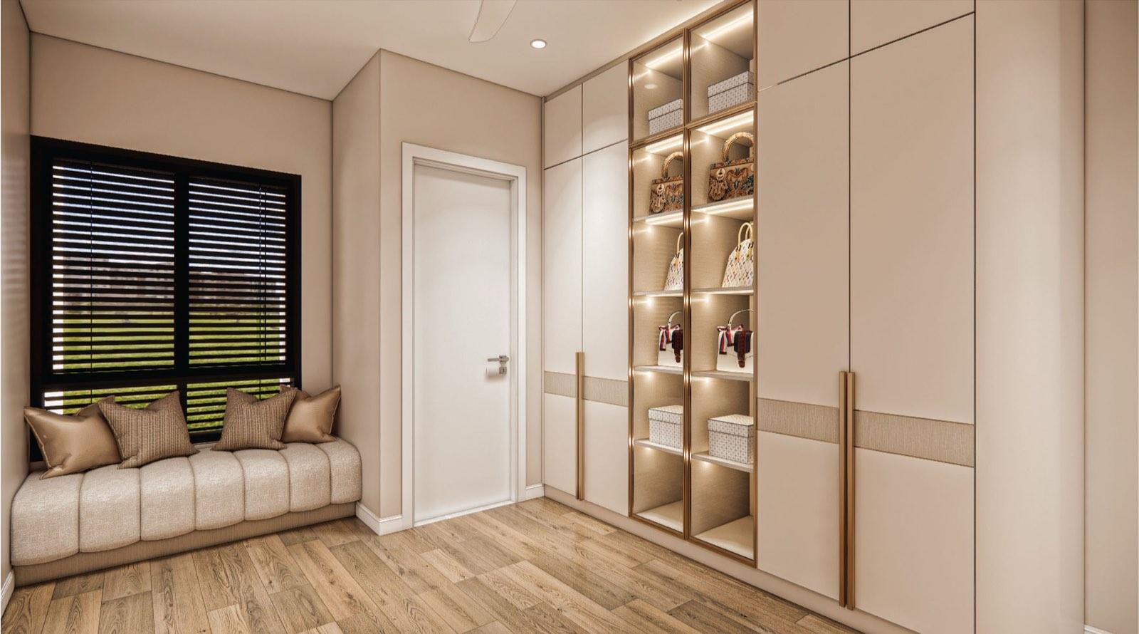 Wardrobe room at Monarc, Gamuda Gardens with a lit handbag display column, full-height cabinetry and a window seat