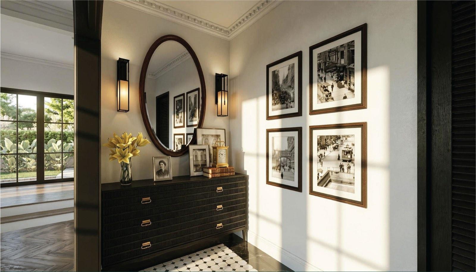 Entry foyer of the Taman Paroi Jaya house with a ribbed black console, oval mirror and gallery of sepia prints