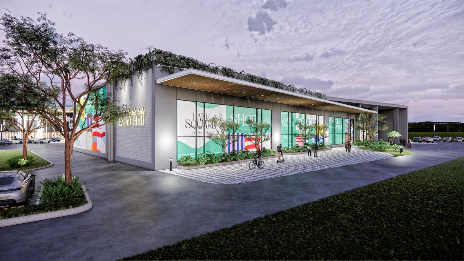 Event hall at PKNS Communal Hub with a planted roof edge and full-height glazed frontage