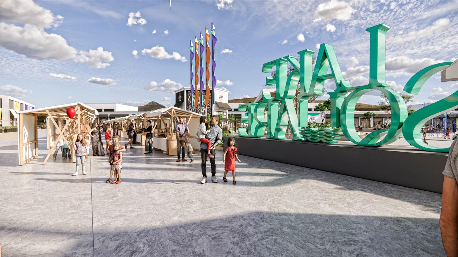Sculptural signage and timber market stalls in the plaza at PKNS Communal Hub