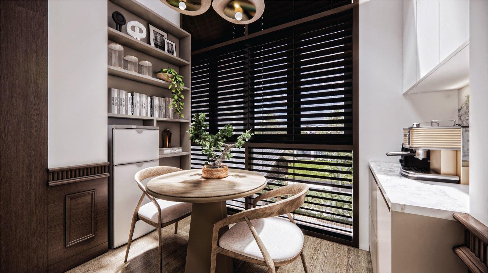 Breakfast nook at the Putrajaya villa with a round timber table and coffee counter beside louvred glazing