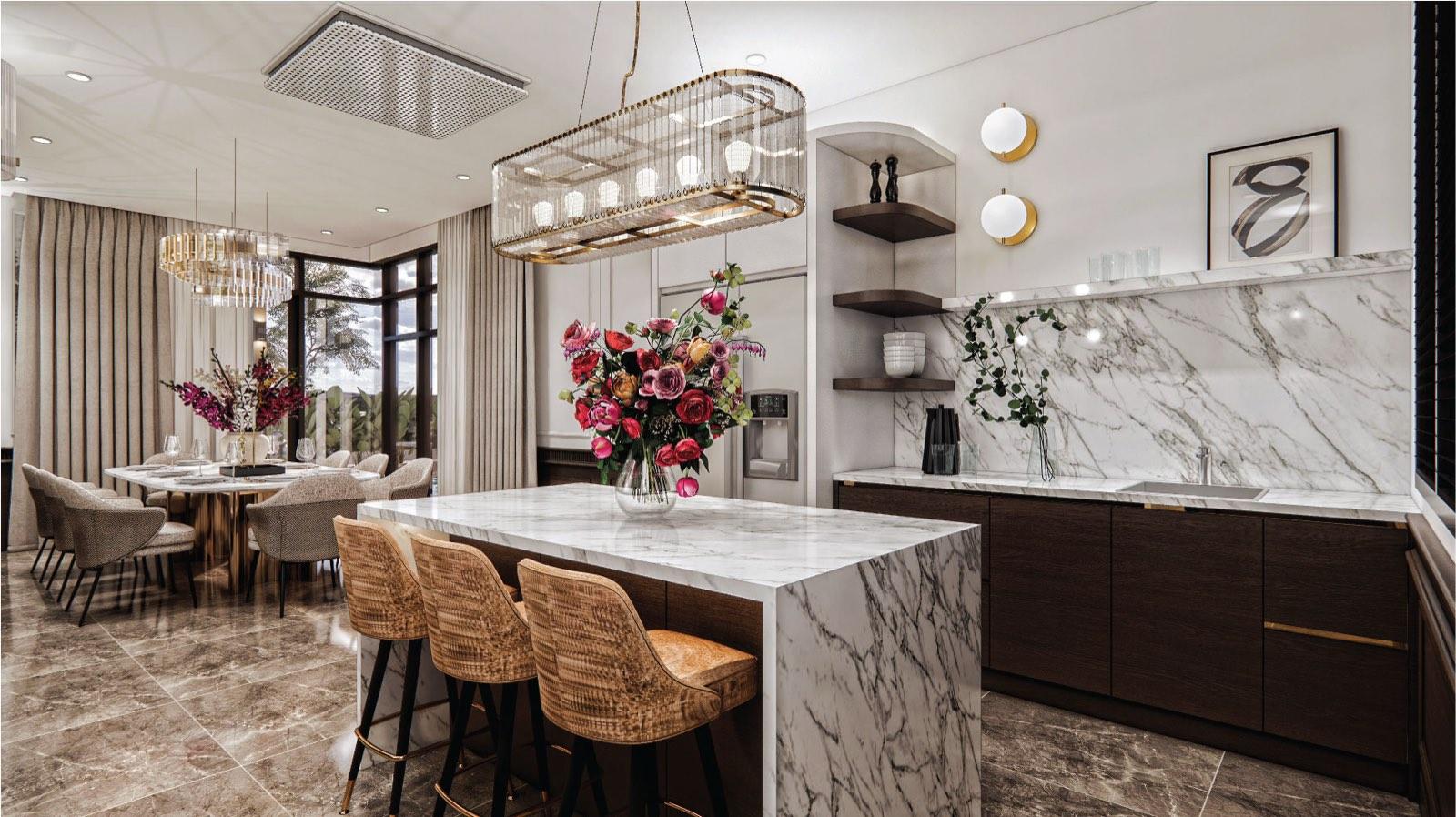 Dry kitchen at the Putrajaya villa with a marble waterfall island, rattan stools and a caged glass pendant