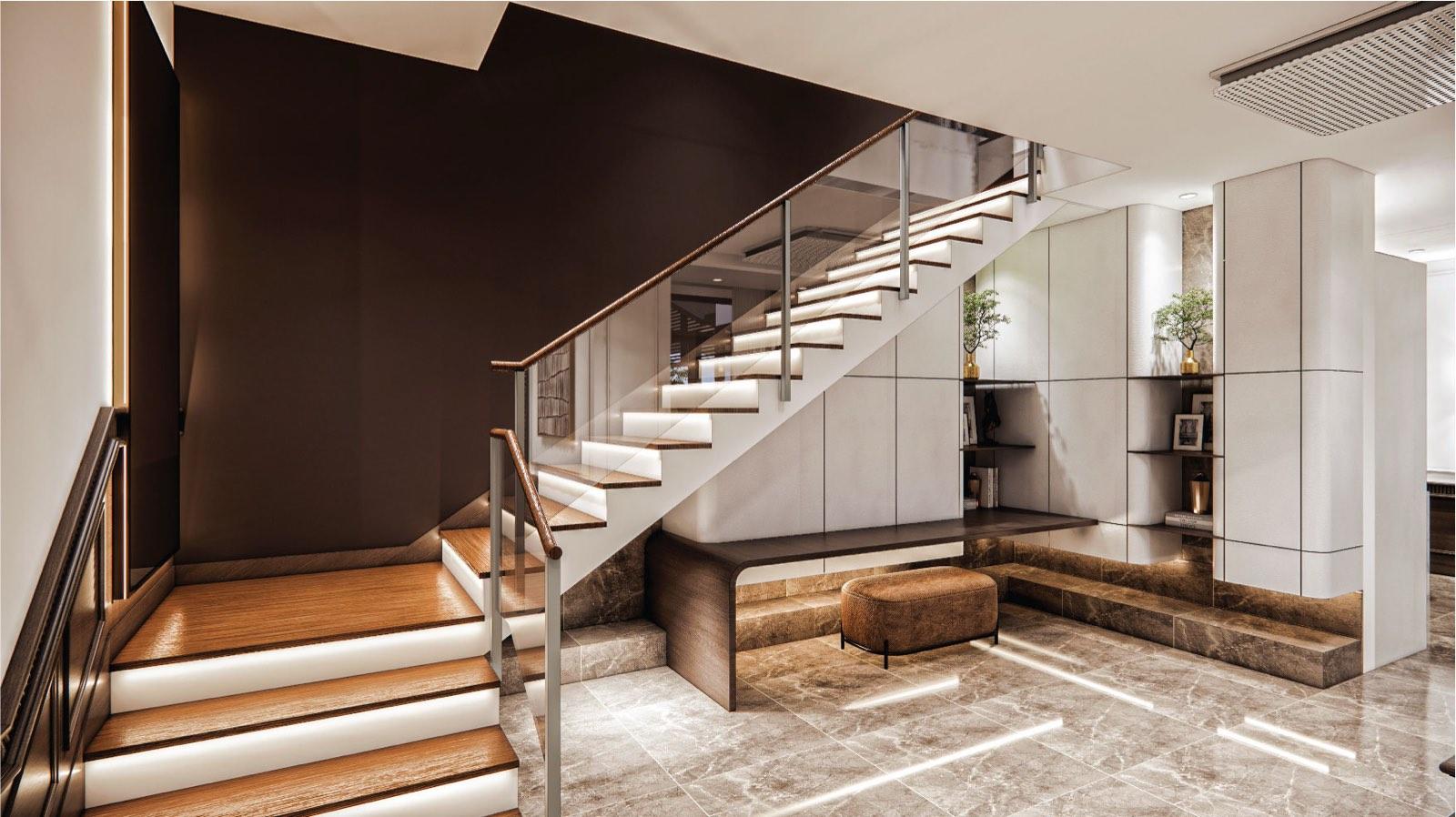 Staircase at the Putrajaya villa with lit timber treads, glass balustrade and a bench below