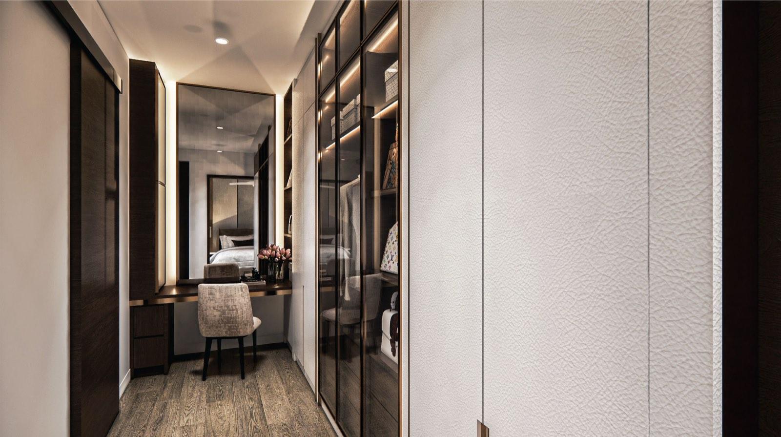 Dressing corridor in the Putrajaya villa master suite with a lit vanity mirror and glazed wardrobe bays