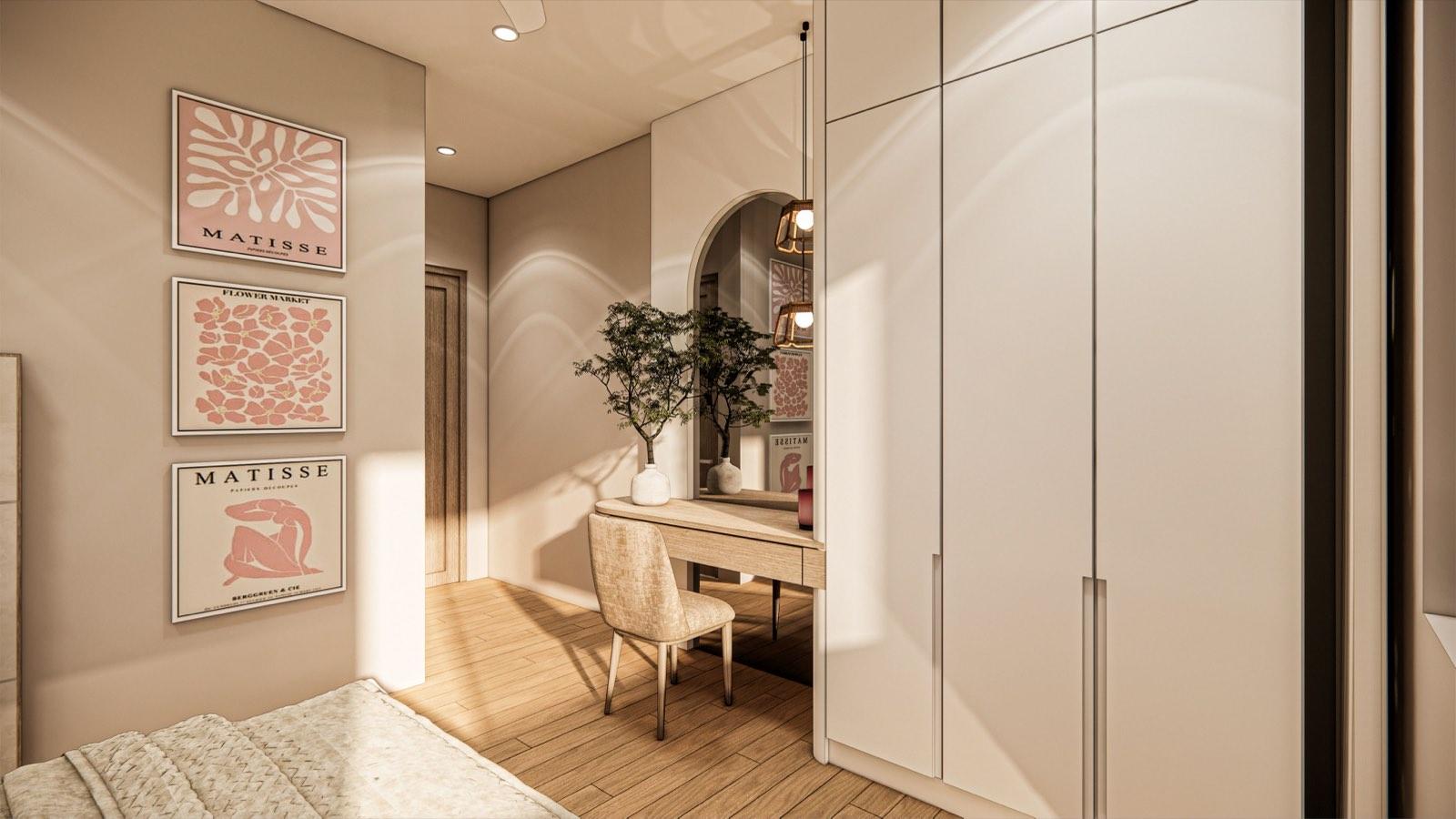 Bedroom of the PKNS SCV Phase 2 show unit with an arched vanity mirror, pale wardrobes and Matisse prints on a blush wall