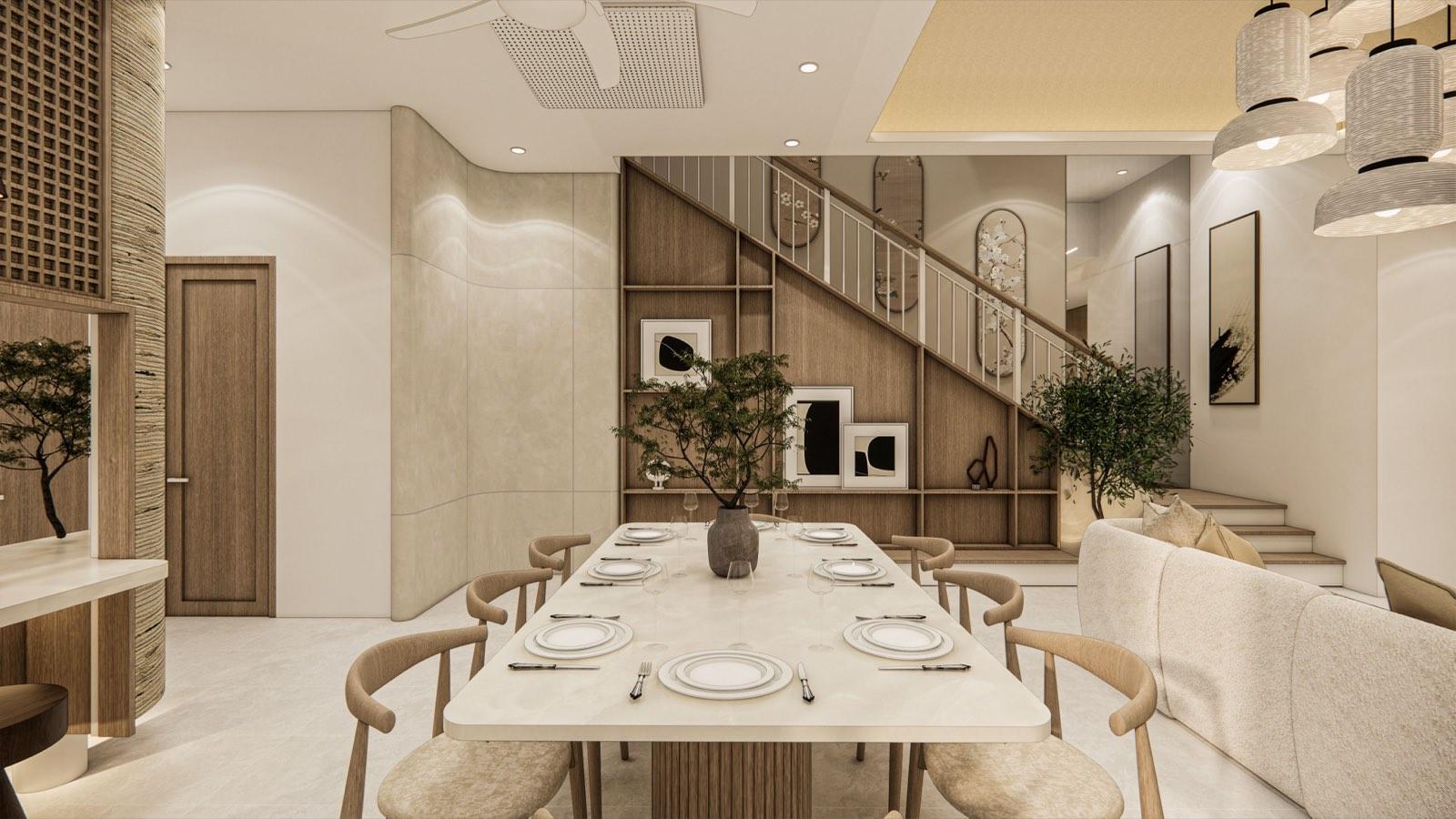 Dining table of the PKNS SCV Phase 2 show unit set below the stair, with framed ink prints and bonsai on the understair shelving