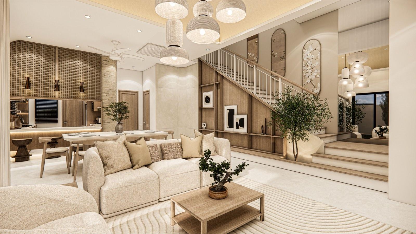 Open-plan living area of the PKNS SCV Phase 2 show unit with the staircase and its understair timber display wall beyond the sofa