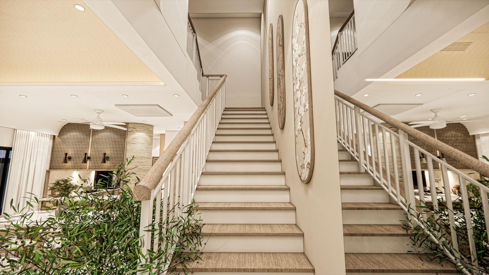 Staircase of the PKNS SCV Phase 2 show unit rising past oval blossom panels, with planting at its foot and white balustrades