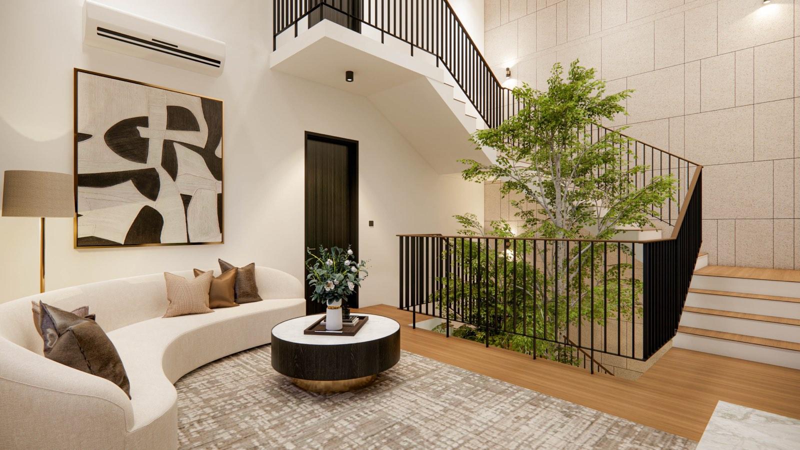 Upper landing lounge of the Sime Darby Modern Grandeur show home, its curved sofa overlooking the tree in the stair void