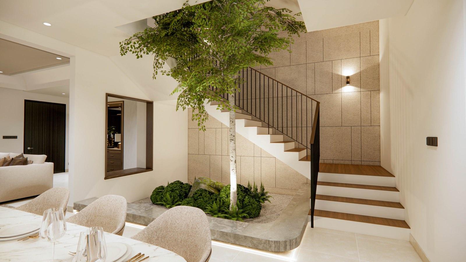 Birch tree growing through the planted stair void of the Sime Darby Modern Grandeur show home