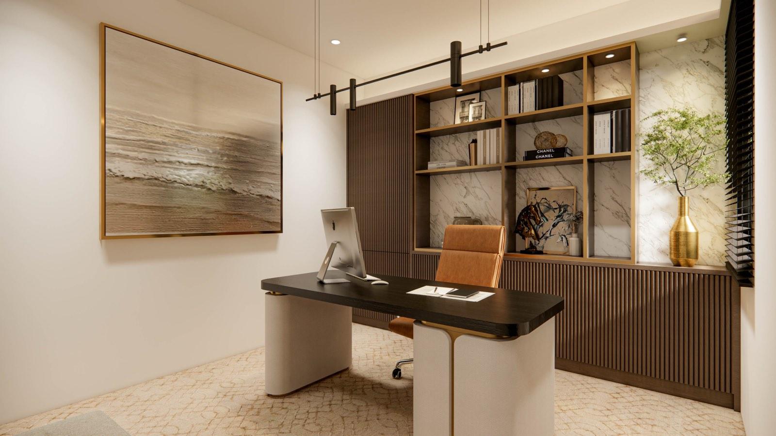 Home office in the Sime Darby Modern Grandeur show home with a black desk, tan leather chair and brass-trimmed shelving