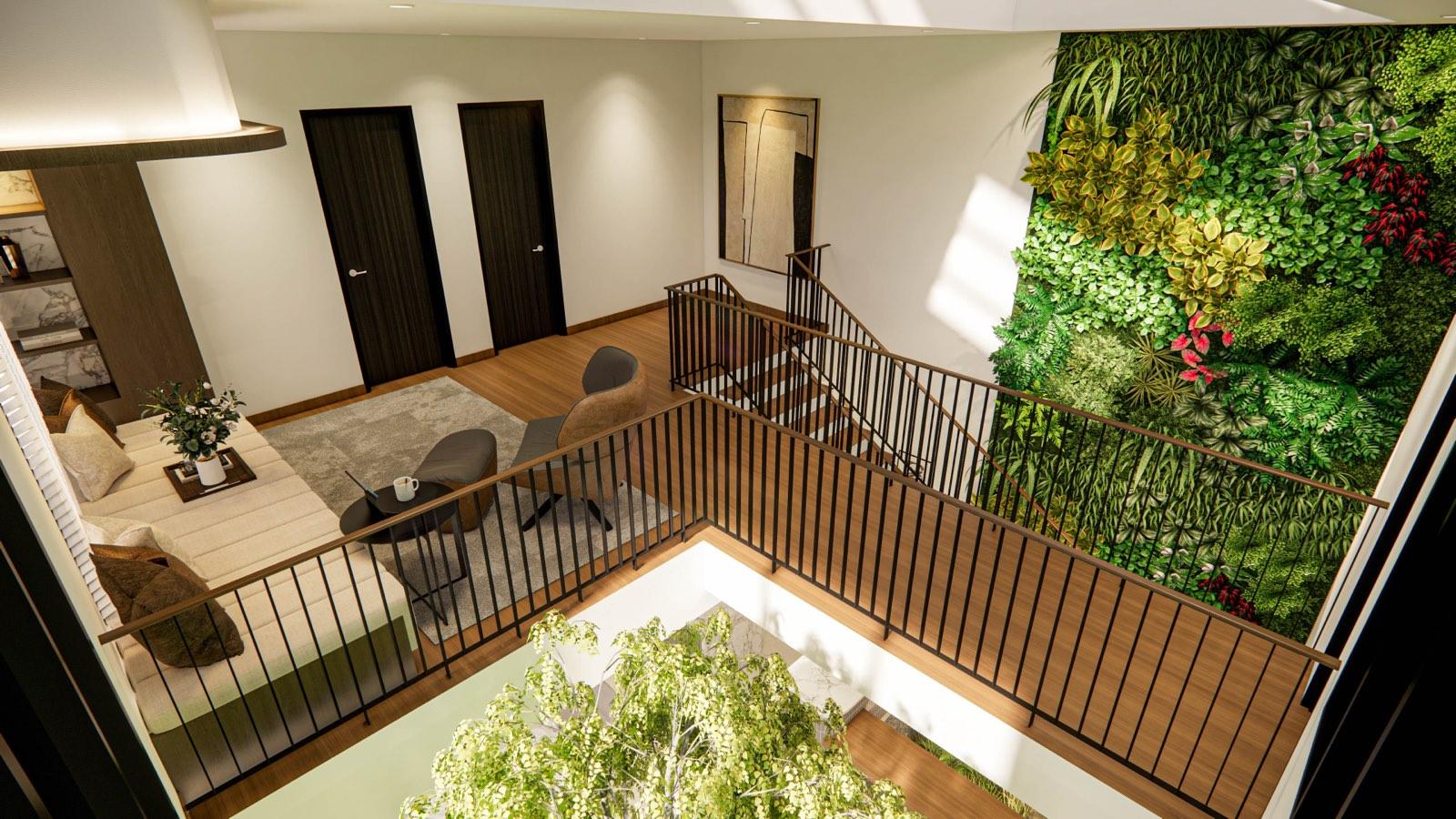 View down over the family landing at the Sime Darby show unit, its void rail, green wall and the courtyard tree below