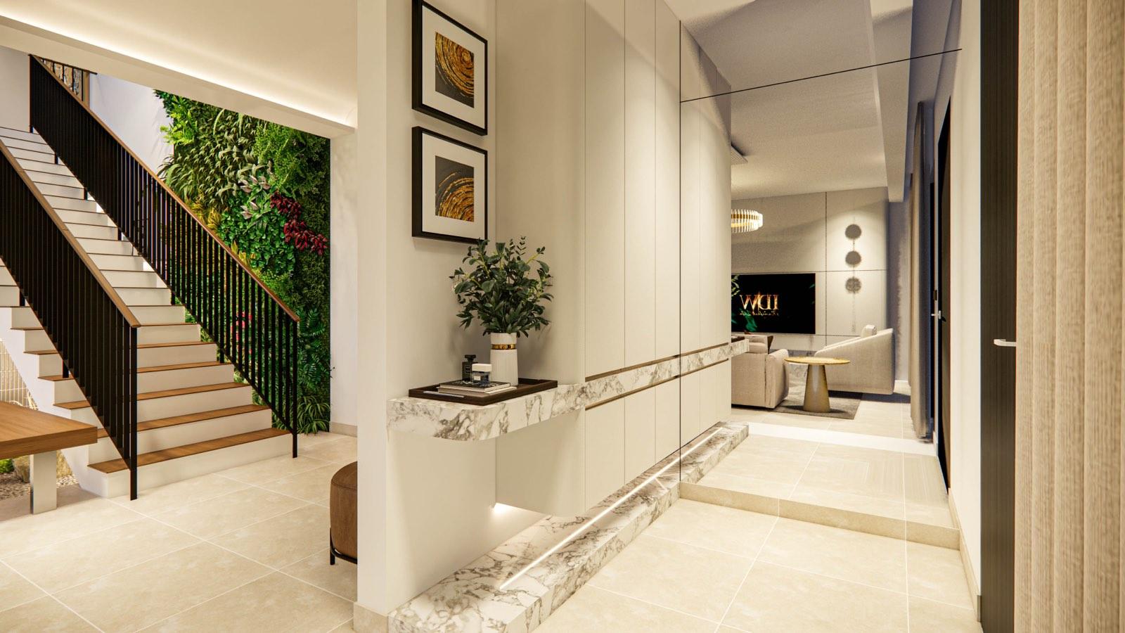 Entry foyer of the Sime Darby show unit with a floating marble console, gold artwork and the green-wall stair beyond