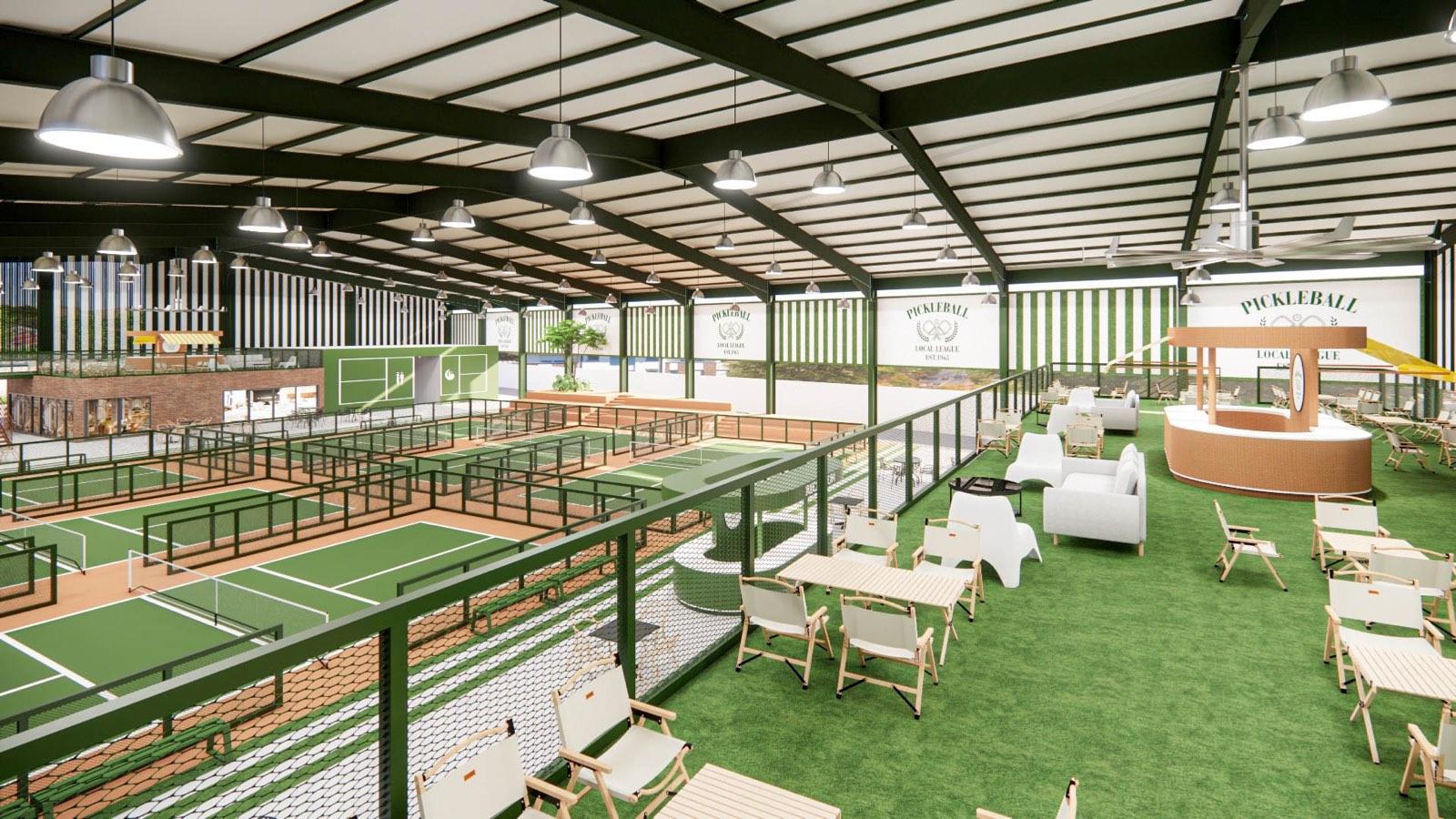 Turfed mezzanine deck with folding chairs, sofas and a striped-awning kiosk at PKNS Signature